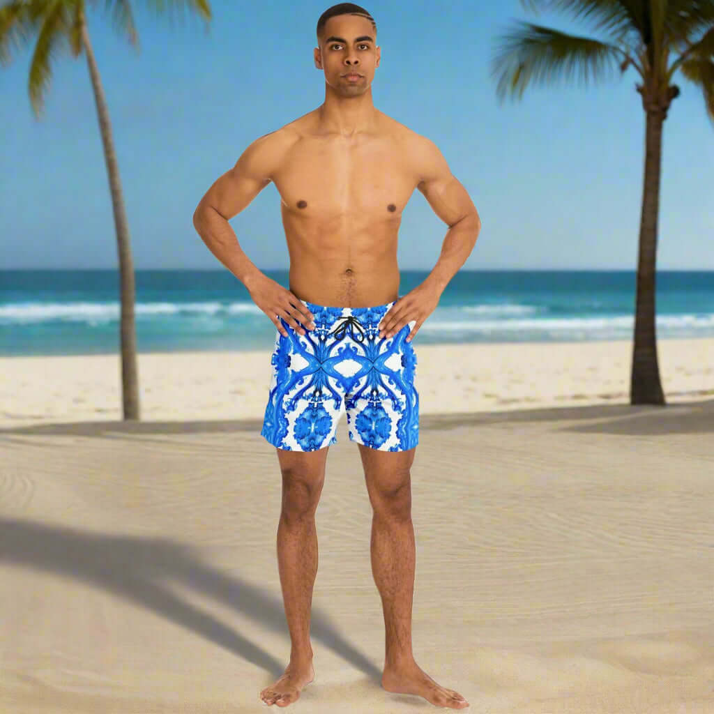 Ocean Blue Cymatic Men’s Swim Shorts on a beach model, quick-dry and stylish swimwear for performance.